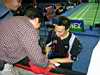 Tony Gunawan, MD Gold medalist (USA)signing my shirt.